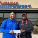 Representatives from Boys and Girls Club accept donation check from ASCU