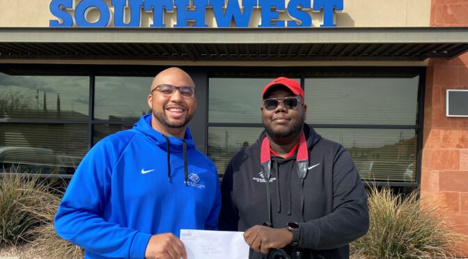Representatives from Boys and Girls Club accept donation check from ASCU